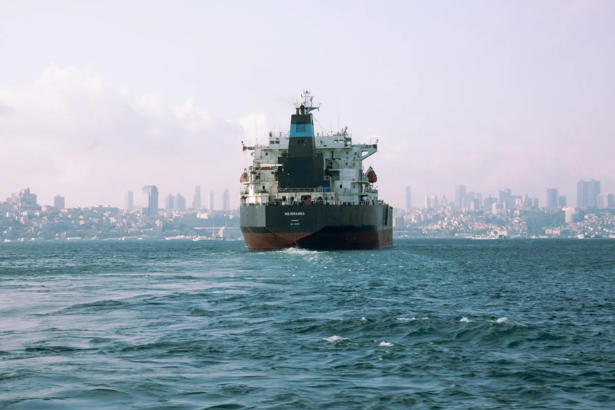 A vessel passing through a strait